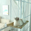 Window mounted PetTime pet nest bed with cozy fabric and secure mounting, suitable for small pets to rest comfortably by the window.