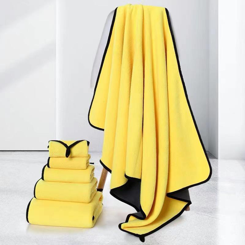 Soft and absorbent PetTime pet bath towel draped over a towel rack, ready for drying a pet after a bath.