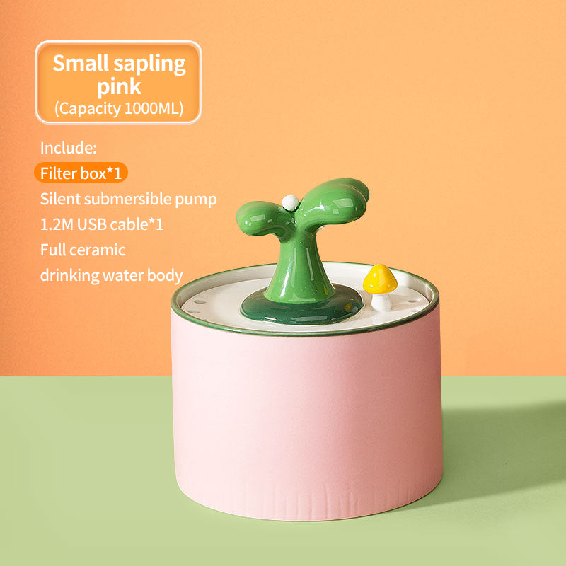 PetTime automatic electric ceramic water dispenser for pets, showing the sleek ceramic design and water spout in use.